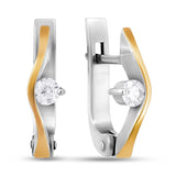 Pair of gold and silver earrings with clear gemstones on a white background