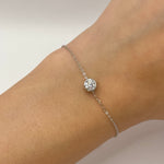 Moissanite bracelet with a delicate crystal symphony design, featuring sparkling stones arranged in an elegant, flowing pattern on a refined metal band.