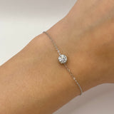 Moissanite bracelet with a delicate crystal symphony design, featuring sparkling stones arranged in an elegant, flowing pattern on a refined metal band.