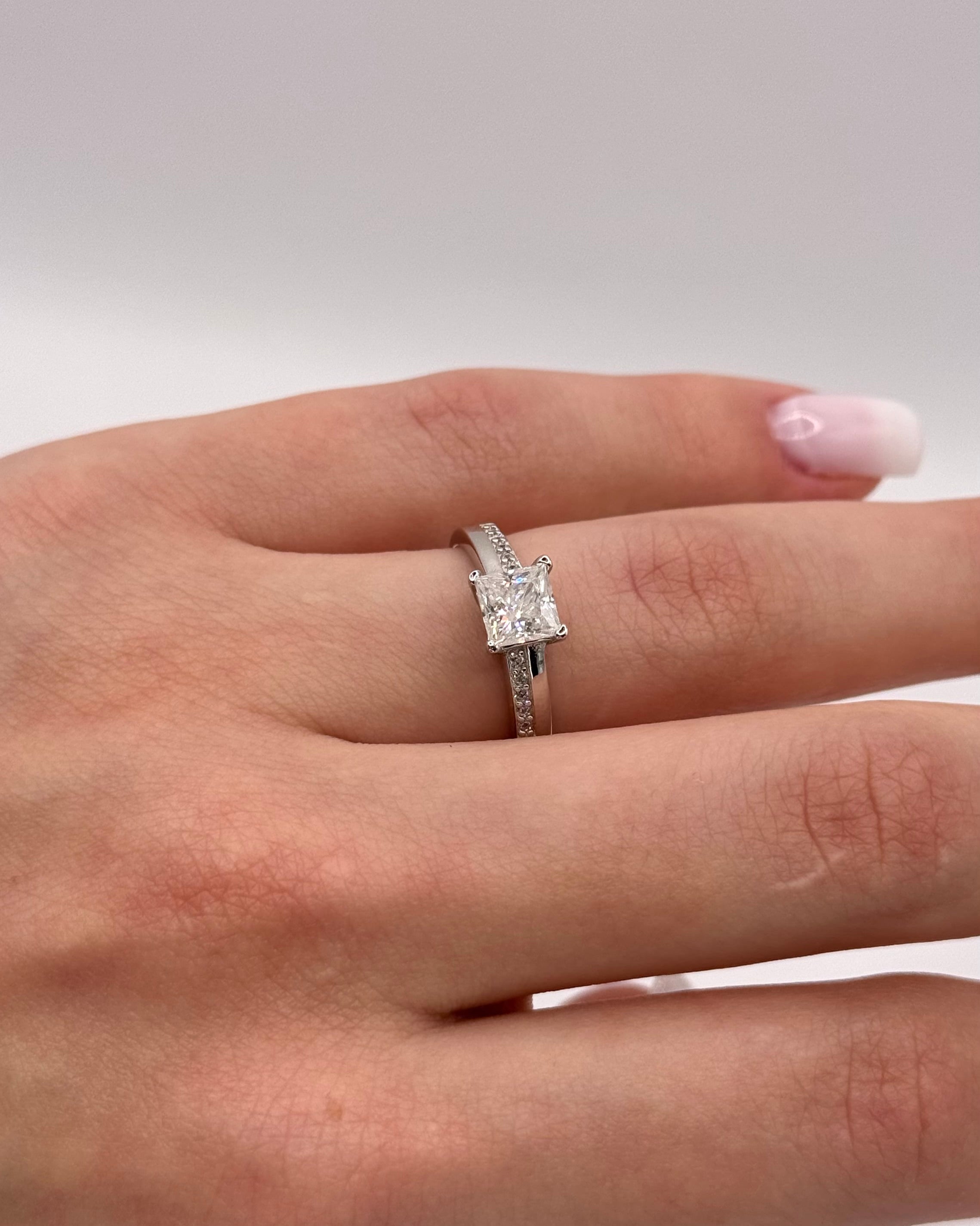 Royal Radiance Moissanite Ring - Brilliant Center Stone in a Polished Metal Band