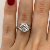 Refined Moissanite Engagement Ring - Polished Metal and Luxurious Shine