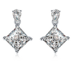 Moissanite stud earrings with a crystal prism-inspired design, showcasing dazzling, precisely cut stones set in a sleek metal frame for a modern, radiant look.