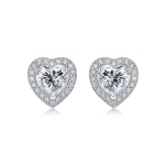 Moissanite stud earrings with a heartfelt design, featuring sparkling heart-shaped stones set in a polished metal frame for a timeless and elegant touch.