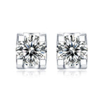 Moissanite stud earrings with a deep space-inspired design, featuring brilliant round-cut stones set in a sleek metal setting for a sophisticated and radiant look.