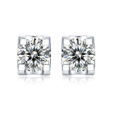 Moissanite stud earrings with a deep space-inspired design, featuring brilliant round-cut stones set in a sleek metal setting for a sophisticated and radiant look.