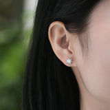 Moissanite Stud Earrings – Starburst Design, Radiant Stones, Polished Metal Frame