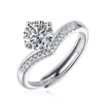 Moissanite engagement ring with a princess design, featuring a brilliant-cut center stone set in a sleek metal band for a sophisticated and timeless look.