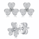 Moissanite stud earrings with a clover-inspired design, featuring sparkling stones arranged in a four-leaf pattern set in a polished metal frame for a timeless and elegant look.