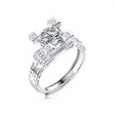 Moissanite ring with a diamond tower design, featuring a brilliant center stone elevated in a sleek metal setting for a bold and sophisticated look.