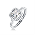 Moissanite engagement ring with a luminous square design, featuring a radiant square-cut center stone set in a sleek metal band for a modern and elegant look.