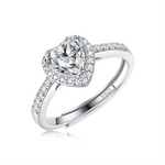 Moissanite ring with a heart design, featuring a sparkling heart-shaped center stone set in a polished metal band for a romantic and elegant look.