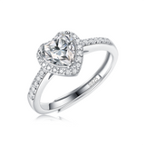 Moissanite ring with a heart design, featuring a sparkling heart-shaped center stone set in a polished metal band for a romantic and elegant look.