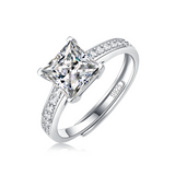 Moissanite engagement ring with a regal reflection design, featuring a brilliant-cut center stone set in a refined metal band for a sophisticated and timeless look.