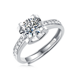 Moissanite engagement ring with an enchanted elegance design, featuring a dazzling center stone set in a polished metal band for a refined and timeless look.