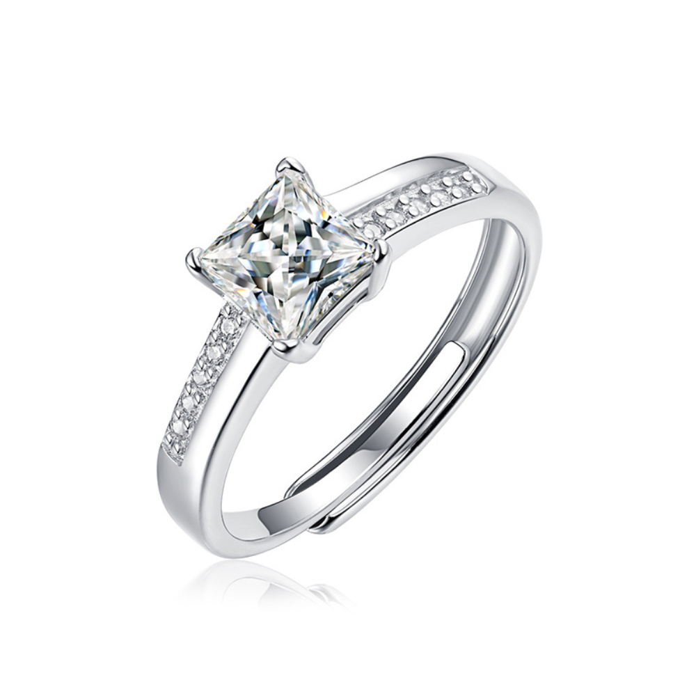 Moissanite ring with a royal radiance design, featuring a brilliant center stone set in a polished metal band for a regal and elegant look.