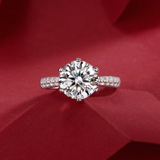 Round moissanite ring in sterling silver showing colored fire