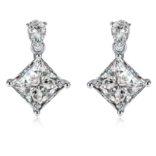 Moissanite stud earrings with a crystal prism-inspired design, showcasing dazzling, precisely cut stones set in a sleek metal frame for a modern, radiant look.