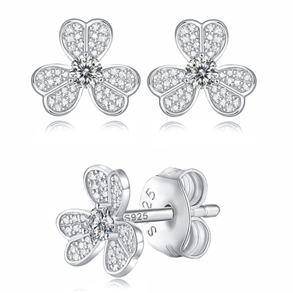 Moissanite stud earrings with a clover-inspired design, featuring sparkling stones arranged in a four-leaf pattern set in a polished metal frame for a timeless and elegant look.