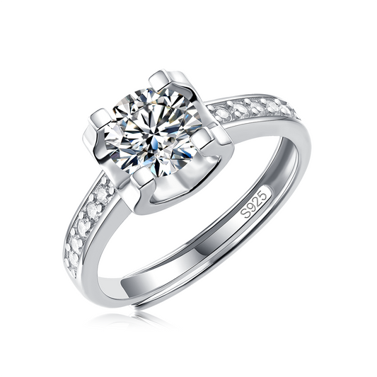 Moissanite engagement ring with an enchanted elegance design, featuring a dazzling center stone set in a polished metal band for a refined and timeless look.