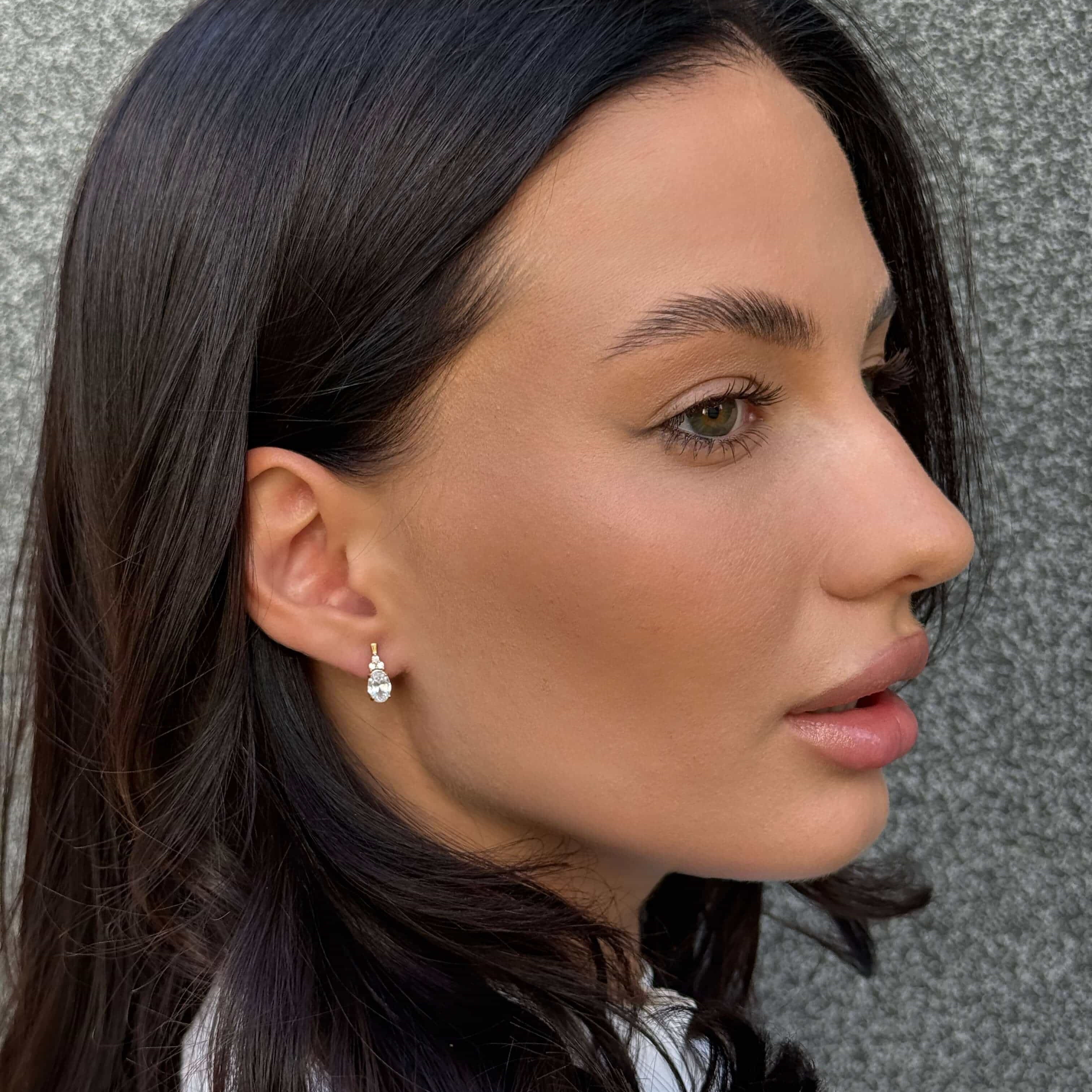 Woman wearing 925 sterling silver earrings – Olivia Star Jewelry