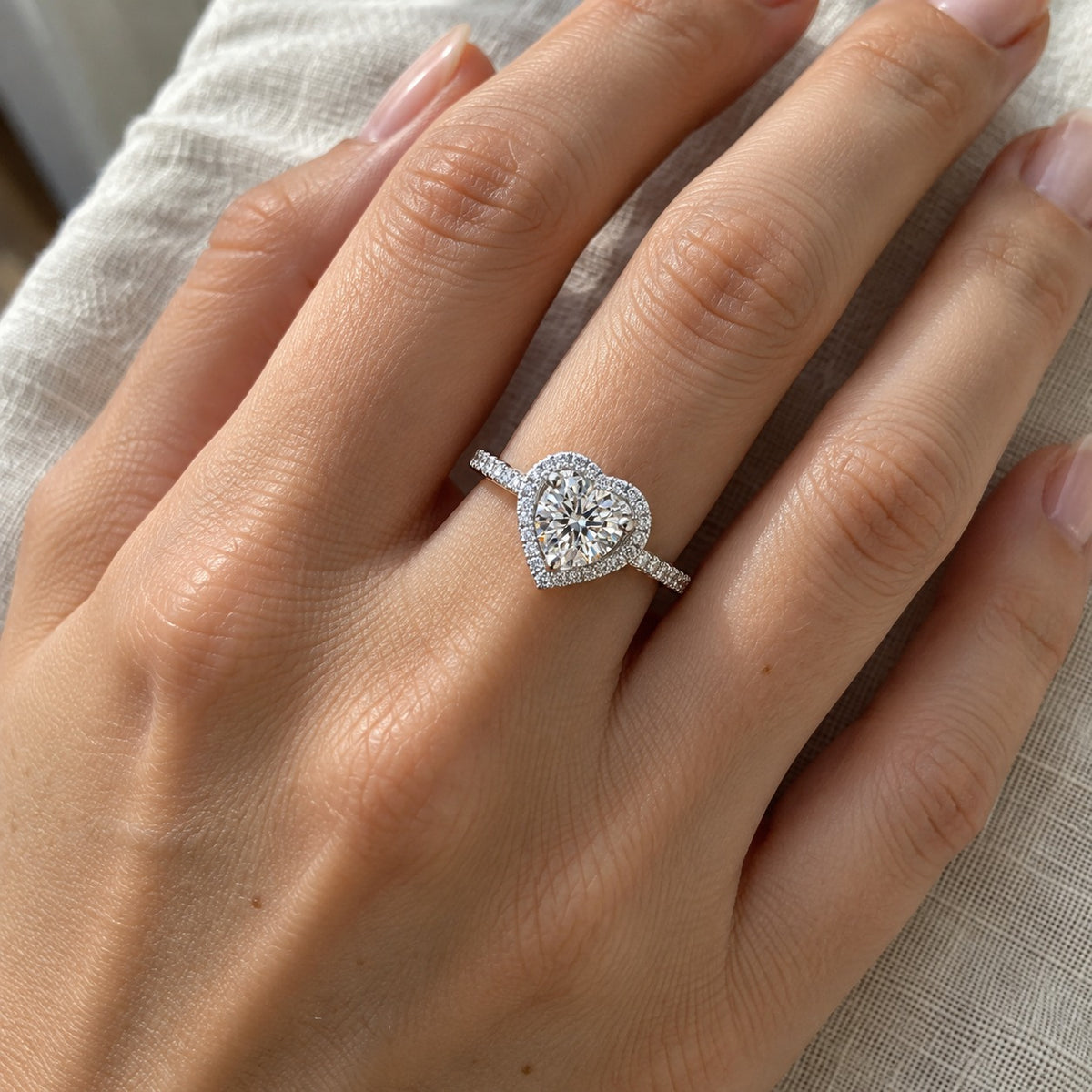 Heartfelt heart halo moissanite ring worn on the hand, true-to-size