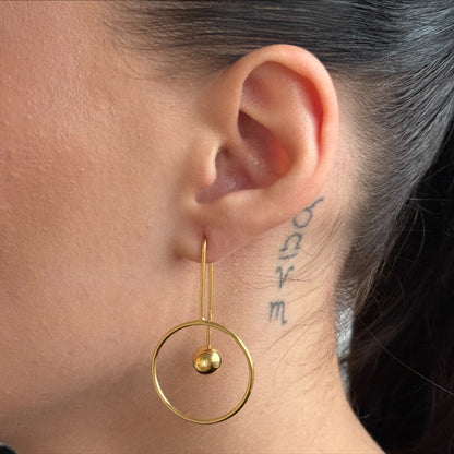 Golden Orbit Ball worn on model
