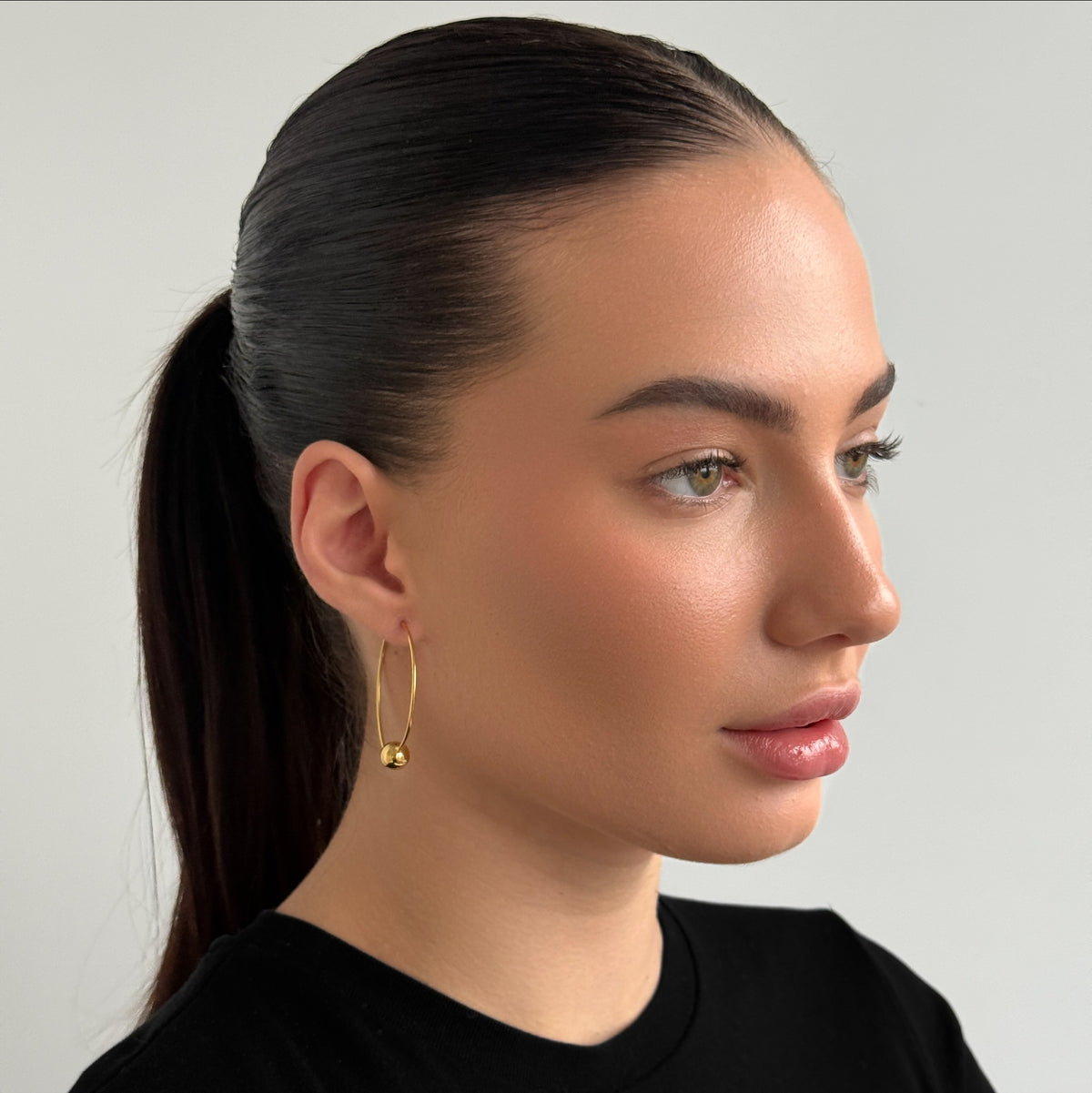 Golden Ball Wire Hoop worn on model