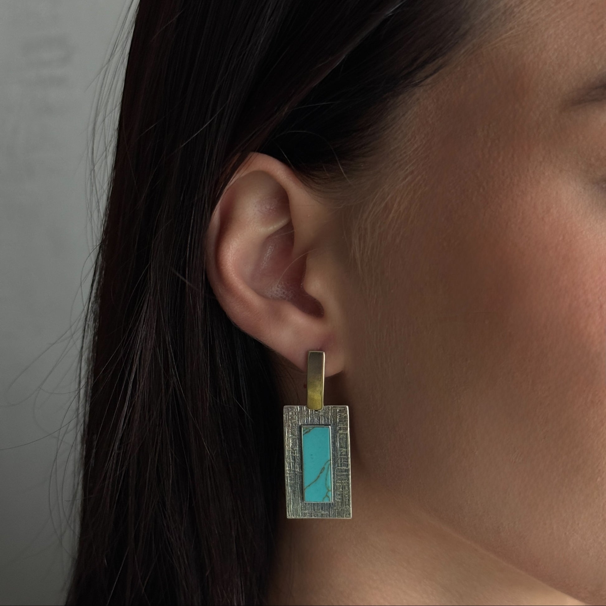 Turquoise Tablet worn on model