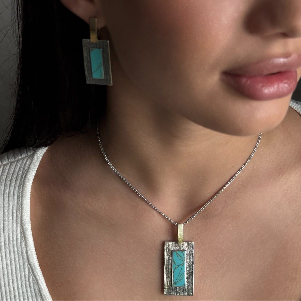 Turquoise Tablet worn on model