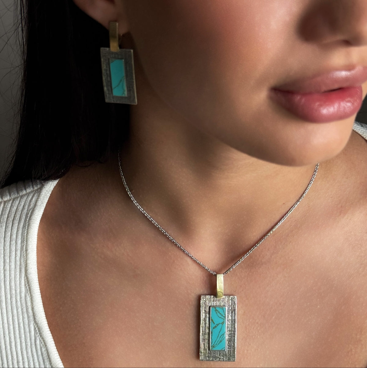 Turquoise Tablet worn on model