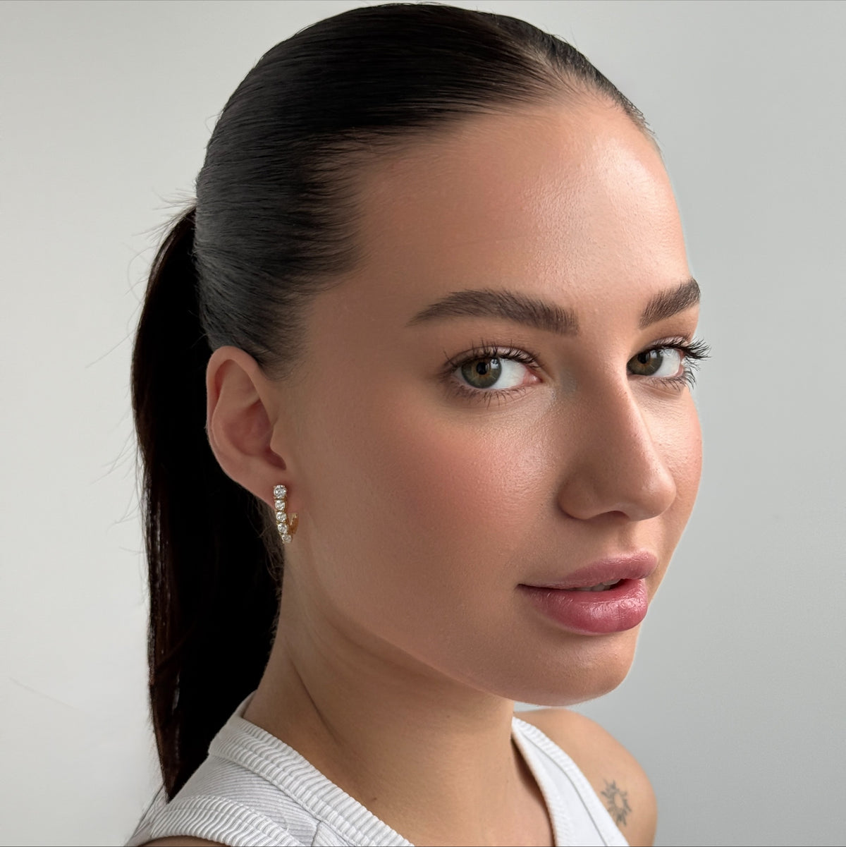 Golden Five-Stone worn on model