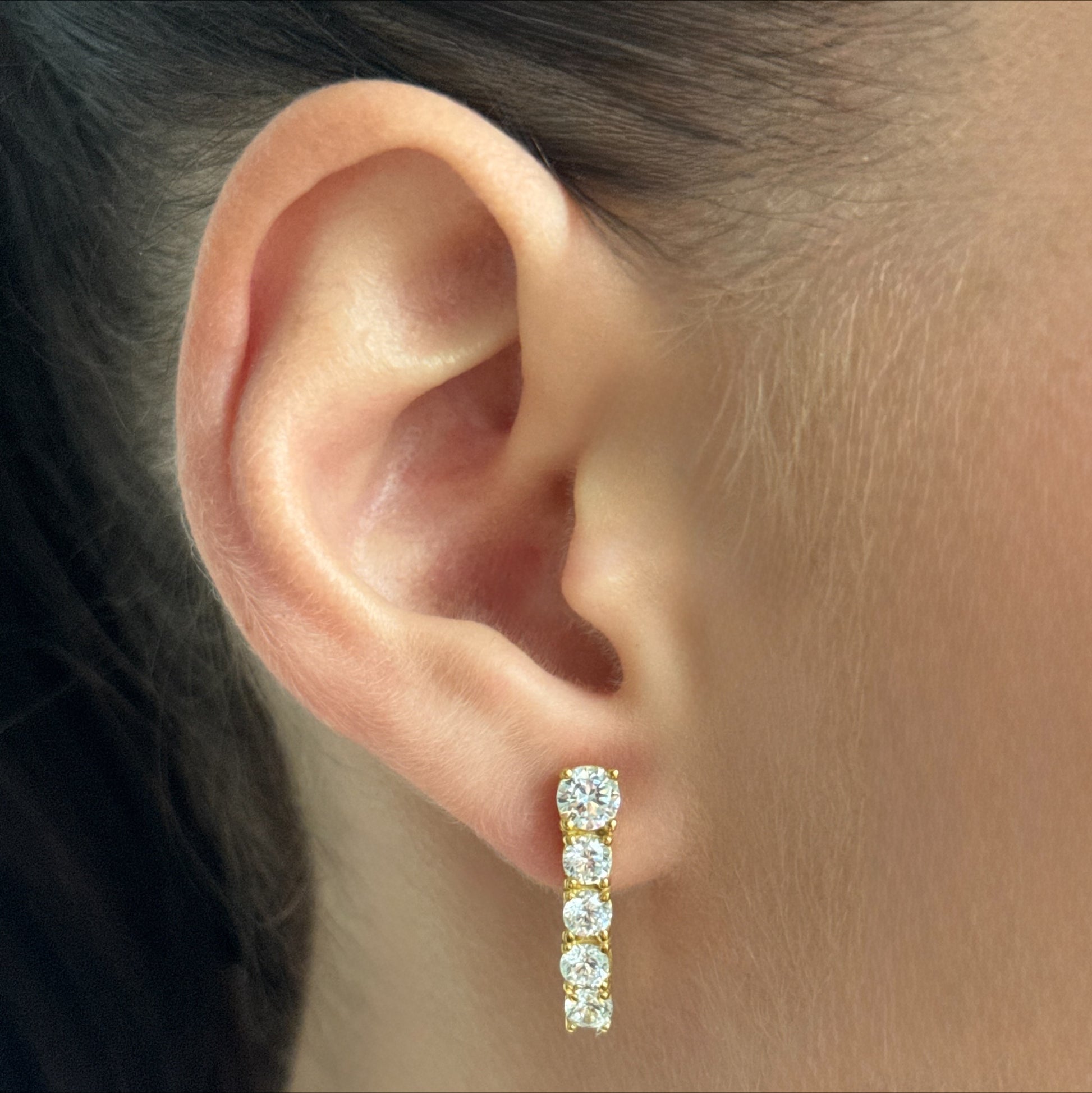 Golden Five-Stone worn on model