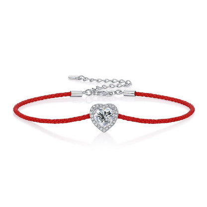 Moissanite bracelet with a heart-shaped charm on an adjustable cord, combining sparkle with a minimalist and modern design for everyday elegance.