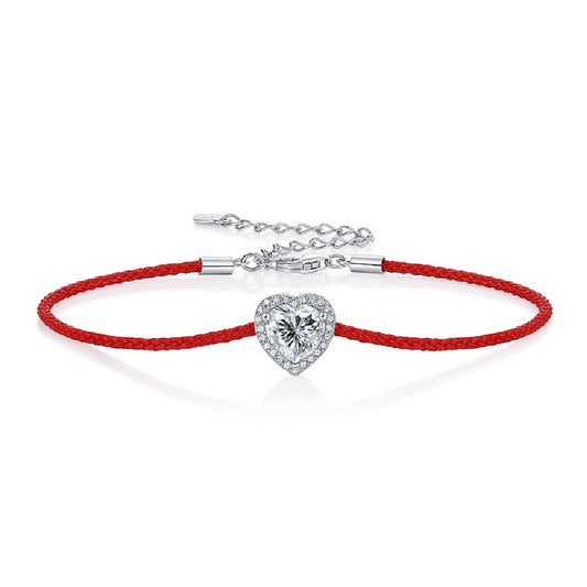 Moissanite bracelet with a heart-shaped charm on an adjustable cord, combining sparkle with a minimalist and modern design for everyday elegance.