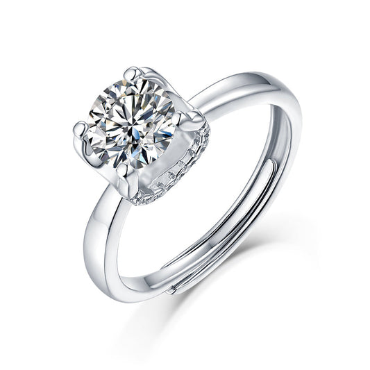 Moissanite engagement ring with a timeless opulence design, featuring a brilliant center stone set in a polished metal band for a sophisticated and luxurious look.
