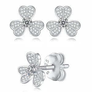 Moissanite stud earrings with a clover-inspired design, featuring sparkling stones arranged in a four-leaf pattern set in a polished metal frame for a timeless and elegant look.